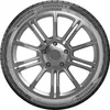 A close-up studio shot of a car tire mounted on a silver alloy wheel. Podgląd zdjęcia produktu
