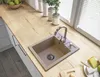 A kitchen sink with a silver chrome faucet on a wooden countertop. Anteprima dell’immagine prodotto