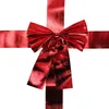 A red ribbon bow with streamers, tied in a cross shape, on a white background. Náhled obrázku produktu