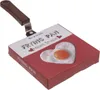 A frying pan with a heart-shaped mold, presented on its packaging. Náhľad obrázku produktu