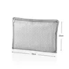 A grey polka dot toiletry bag with dimensions indicated. Voir les images du produit