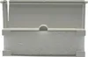 A close-up, front-facing view of a skimmer flap or weir for a pool skimmer, made of light gray plastic and white foam filter material. Produktbild-Vorschau