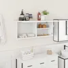 A white wall-mounted bathroom cabinet with various toiletries and towels on display. Produktbild-Vorschau