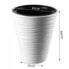 A white planter with a wavy pattern and dimensions indicated. Voir les images du produit