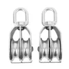 Two stainless steel double pulleys are shown against a white background. Voir les images du produit