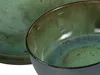 A close-up view of a green and blue glazed ceramic bowl and a plate. Produktbild-Vorschau