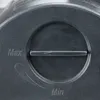 A close-up view of a dial or adjustment mechanism on a dark gray product, with markings for 'Max' and 'Min'. Produktbild-Vorschau