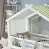 A close-up view of a white wooden house-shaped bed with green and white striped curtains and canopy. Anteprima dell’immagine prodotto