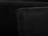 A close-up view of the corner of a black fabric item. Náhled obrázku produktu