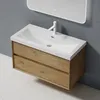 A modern bathroom vanity with a sink and faucet, set against a gray wall and a speckled white floor. Produktbild-Vorschau