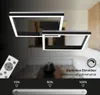 A modern, geometric ceiling light fixture with integrated LED lighting, shown in a dimly lit room with a remote control and a dimming slider graphic. Anteprima dell’immagine prodotto