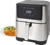 An air fryer with a digital display and a plate of food next to it. Produktbild-Vorschau
