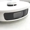 Close-up view of the top and front of a white robot vacuum cleaner. Voir les images du produit