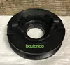 A black pulley with green text on a white and wood background. Produktbild-Vorschau