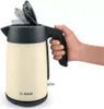 A hand is holding a cream-colored Bosch electric kettle with a black lid and handle. Anteprima dell’immagine prodotto