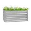 A silver metal raised garden bed filled with various green plants, photographed against a white background. Náhled obrázku produktu