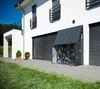 A modern white house with a gray metal bicycle garage in front, containing two bicycles. Náhľad obrázku produktu