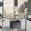 A round glass tabletop with a wicker planter underneath, set on an outdoor patio with drinks on the table. Anteprima dell’immagine prodotto