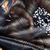 A close-up view of a fabric with a floral pattern. Produktbild-Vorschau