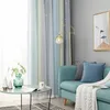 A living room scene with a sofa, curtains, and a coffee table. Voir les images du produit