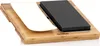 A lava stone set for cooking, including a stone, a plate, and a wooden board. Produktbild-Vorschau