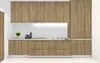 A modern kitchen with wooden cabinets and white tiled backsplash. Produktbild-Vorschau