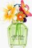 A bottle of Marc Jacobs Daisy Wild Eau So Intense perfume with decorative flowers on top. Voir les images du produit