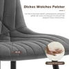 Close-up of a gray upholstered chair seat with text overlays highlighting its features. Voir les images du produit