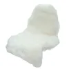 A white sheepskin rug is shown against a white background. Produktbild-Vorschau