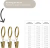 A size chart showing the number of rings needed for different curtain rod lengths, alongside an image of three curtain rings with clips. Produktbild-Vorschau