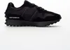 A black New Balance sneaker shown from the side against a white background. Anteprima dell’immagine prodotto