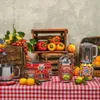 A collection of Smeg kitchen appliances and fresh produce arranged on a red and white checkered tablecloth. Voir les images du produit