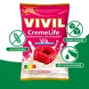 A product package for VIVIL CremeLife Raspberry sugar-free cream candies, with various icons and text highlighting its features. Produktbild-Vorschau