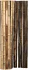 A close-up view of a bamboo fence or screen, composed of vertical bamboo poles of varying colors and thicknesses. Náhled obrázku produktu