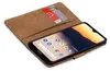 A book-style phone case with two credit cards inserted, showing a smartphone screen with app icons. Produktbild-Vorschau