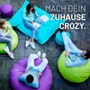 People relaxing on beanbag chairs outdoors. Anteprima dell’immagine prodotto