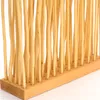 A close-up view of a wooden room divider made of thin, vertical wooden sticks. Náhľad obrázku produktu