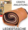 A rolled-up bundle of leather pieces in various shades of brown, with an instructional sheet and promotional text in the background. Produktbild-Vorschau