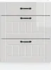 A white wooden cabinet with three drawers and black handles. Náhled obrázku produktu