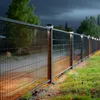A fence with solar lights at dusk. Voir les images du produit