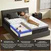 A mattress is shown with a cutaway view highlighting its layers, and a woman is lying on it. Produktbild-Vorschau