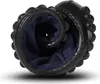 A black shoe rolled up on a white background. Produktbild-Vorschau