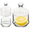 Three glass containers with lids, one containing a lemon slice. Náhled obrázku produktu