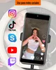 A ring light is shown with a smartphone displaying social media apps and a person making a heart shape with their hands. Produktbild-Vorschau