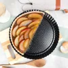 A tart pan with half of an apple tart in it, placed on a wooden board. Produktbild-Vorschau