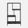 A black metal bookshelf with four shelves arranged in an asymmetrical design, presented against a plain light gray background. Anteprima dell’immagine prodotto
