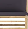Close-up view of a bamboo sofa frame with a dark gray cushion. Produktbild-Vorschau