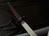 A close-up shot of a katana and wakizashi set on a black fabric background. Voir les images du produit