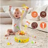 A baby is playing with a duck-themed interactive game on a carpeted floor. Náhľad obrázku produktu