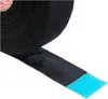A roll of black fabric tape with a section unrolled and showing a blue adhesive strip. Podgląd zdjęcia produktu